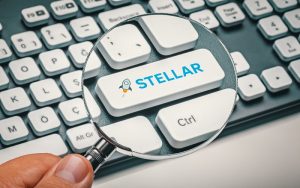 magnifying glass in hand focused on computer key with stellar logo 300x188 - اخبار شنبه مورخ 97/12/25