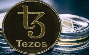 Coin cryptocurrency Tezos on the background of a stack of coins. XTZ coin. Image 300x188 - اخبار یک‌شنبه مورخ 98/9/3